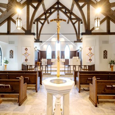 Large open area modern church with natural wood exposed rafters